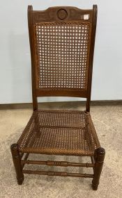Antique Walnut Caned Low Chair