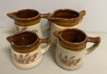 Four Stoneware Brown Creamers