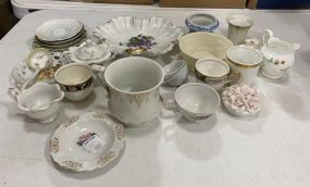 Assorted Group of Porcelain Plates, Demi Tasse Cups, and Saucers