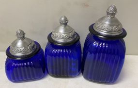 Three Blue Glass Canisters