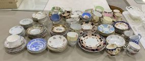 Large Collection of Porcelain Demi Tasse Cups and Saucers