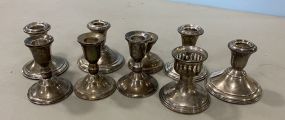 Nine Weighted Sterling Candle Sticks