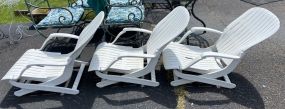 Three Outdoor Plastic Lounge Chairs
