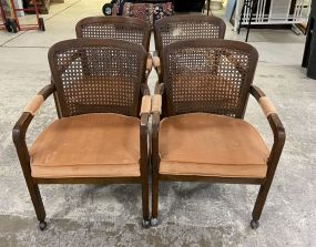 Four Caned Back Chairs