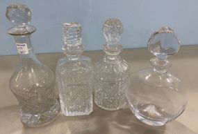 Four Pressed Glass Decanters