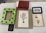 Two Floral Prints, Courtyard Drawing, Books, Polka Dot Frame.