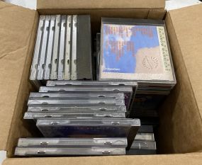Box Lot of 44 CDs, 6 Tapes Cassettes, and 10 Dvds.