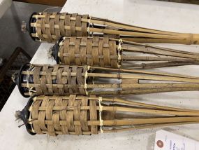 Four Used Cane Tiki Torches