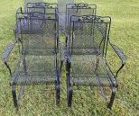 Four Wrought Iron Patio Arm Chairs