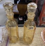 Pair of Colored Glass Apothecary Bottles with Stoppers