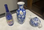 Blue and White Teapot, Flower Vase, and Decorative Wine Bottle