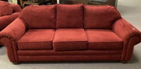Red Upholstered Three Cushion Sofa