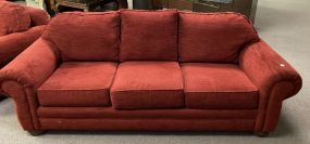 Red Upholstered Three Cushion Sofa