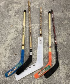 Group of Kids Hockey Sticks