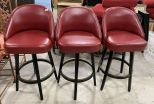 Three Red Vinyl Bar Stools