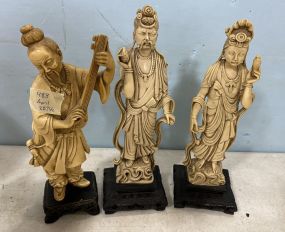 Three Carved Resin Asian Sculptures