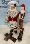 Two Santa Claus Decorations and Metal Train