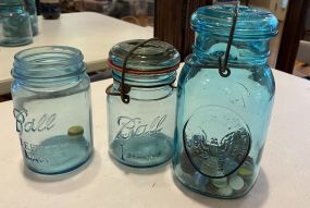 Two Blue Ball Jars and Jar with few Marbles