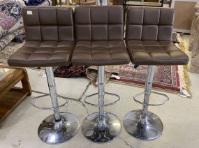 Three Vinyl Swivel Bar Stools