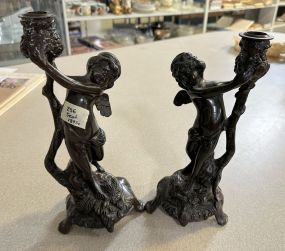 Pair of Bronze Cherub Candlesticks