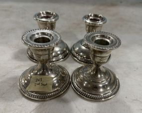 Four Sterling Weighted Candle Holders