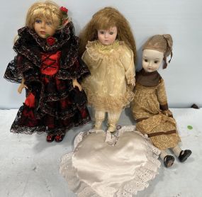 Two Porcelain Girl Dolls and Plastic Doll