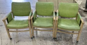 Three Mid Century Bamboo Rolling Arm Chairs