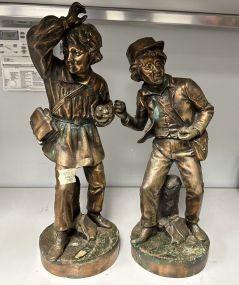Two Metal Boy Statues