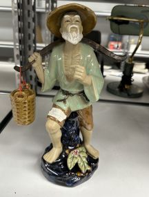 Chinese Mud Man Carrying Water