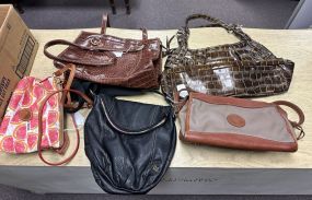Group of Ladies Carrying Bags and Purses