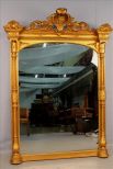 Gold over the mantle mirror with lady head in crown