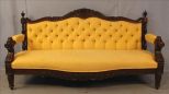 Rosewood Victorian sofa with yellow upholstery