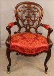 Laminated rosewood arm parlor chair by Meeks