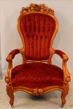 Tall walnut Victorian parlor chair with carving
