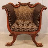 Mahogany saddle chair with claw feet