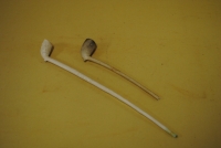 TWO CLAY PIPES; one with embossed coat of arms and other with initials ES