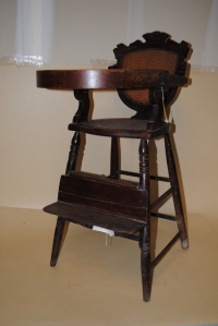 VICTORIAN HIGHCHAIR; cane seat and back; mixed woods, oak and walnut; late 19th Century