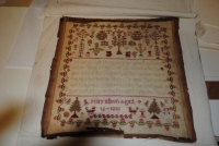 ENGLISH SAMPLER ON LINEN; with floral and tree decorative; pius verse; Marked Mary Ellson aged 12 dated 1830