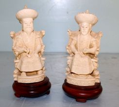 Two Faux Ivory Carved Figurines