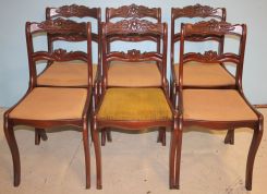 Six Mahogany Rose Caved Chairs