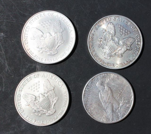 1923 Peace Silver Dollar and Three Walking Liberty Silver Dollars