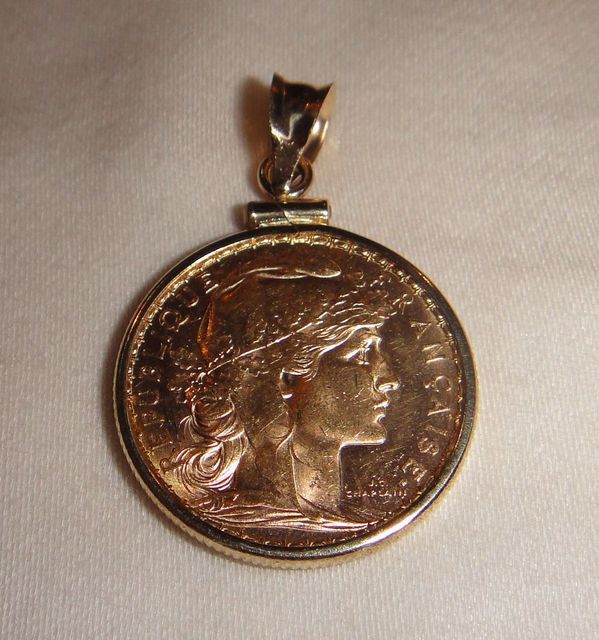 One 21KT and 14KT yellow gold gents combination cast & die struck gold coin pendant