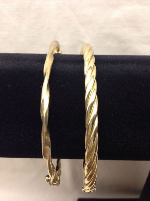Two stamped 10KT yellow gold lady's bangle bracelets