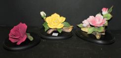 Group of Three Porcelain Roses on Stands